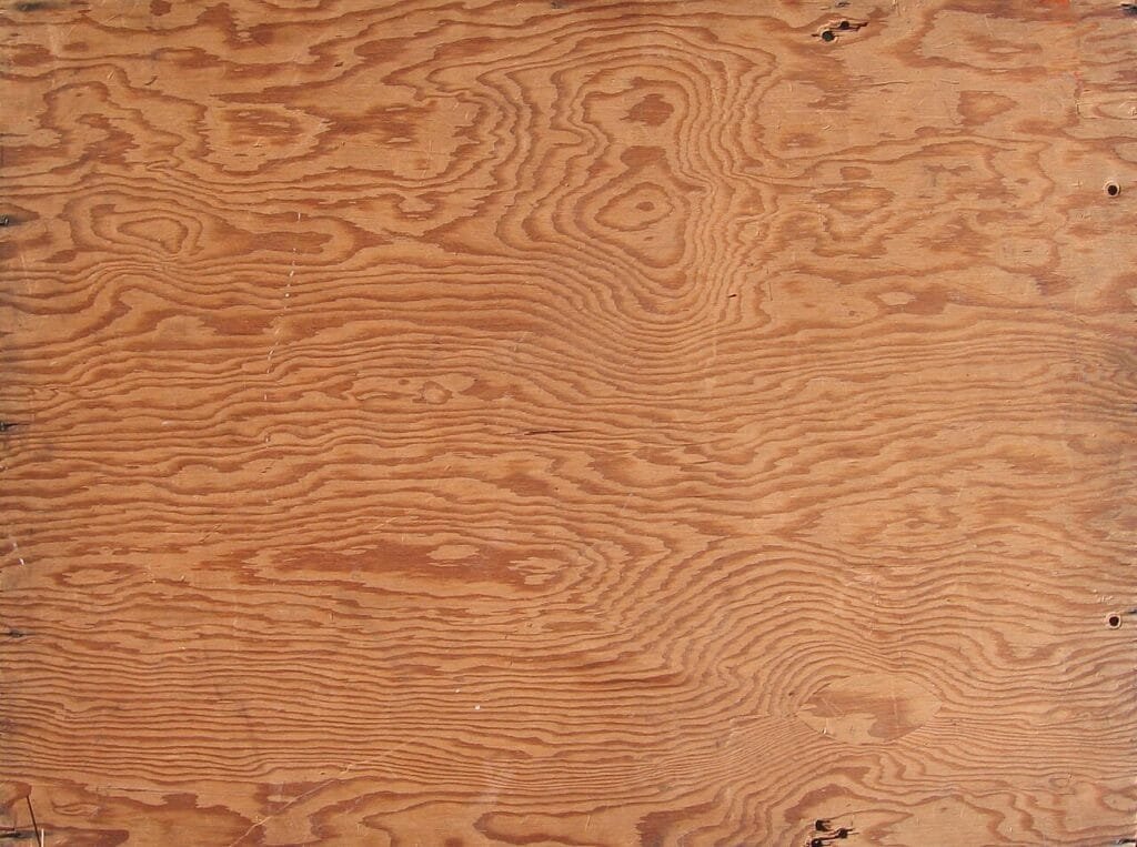 Close-up of plywood sheet grain, a common material in interior carpentry work